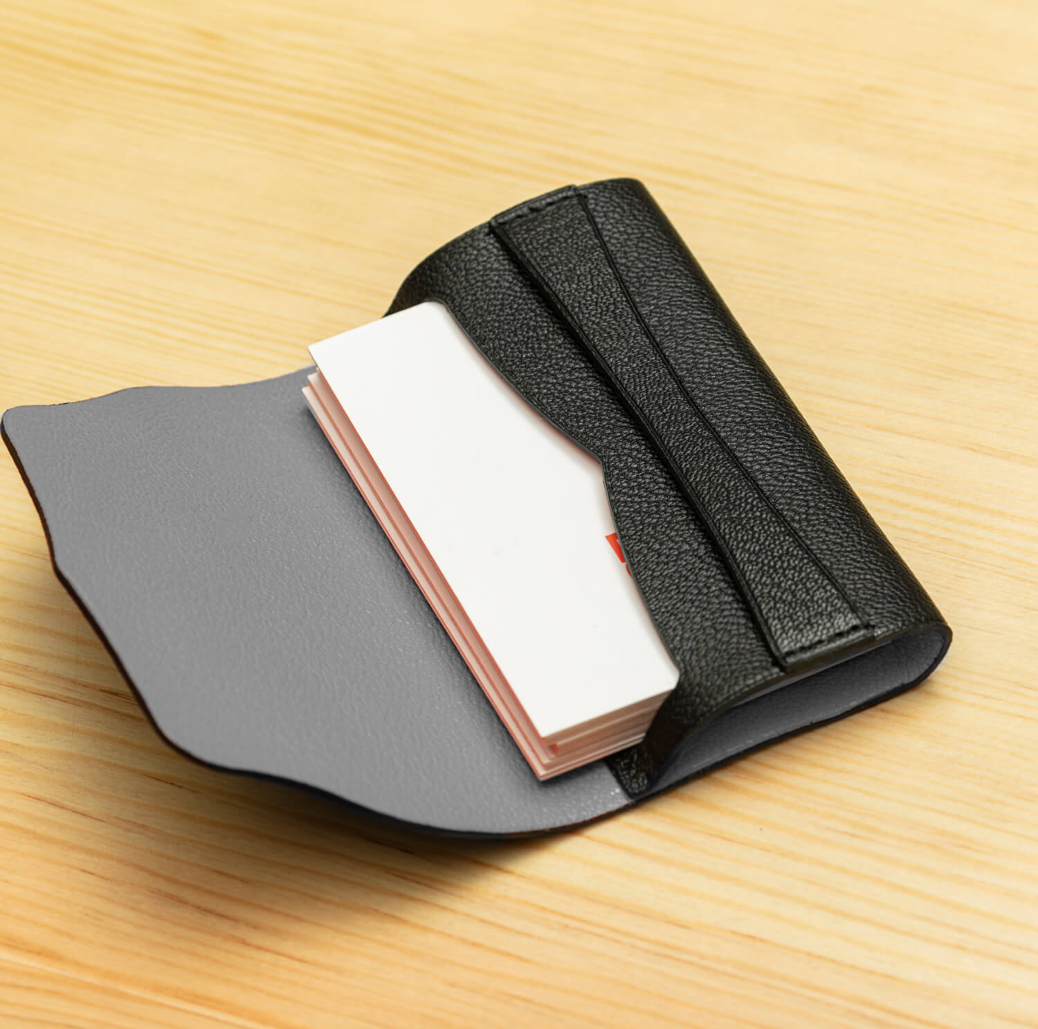 Serel's Natty Business Card Holder cover open on the table